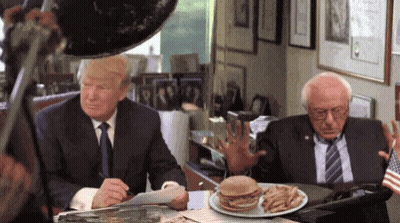 Donald Trump And Bernie Sanders Sitting At Table With Hamburger And Fries GIF