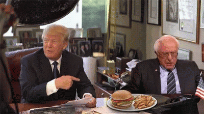 Donald Trump And Bernie Sanders Sitting At Table With Hamburger And Fries GIF