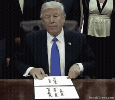 Donald Trump At Table With Donald Draws.com Sign GIF