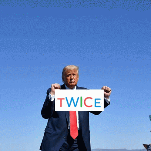 Donald Trump Holds Sign Saying Twice In Front Of Blue Sky GIF