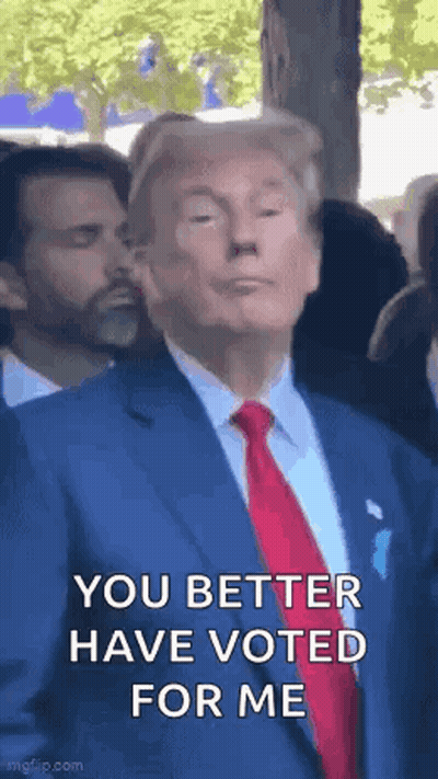 Donald Trump In Blue Suit And Red Tie Making Funny Face GIF