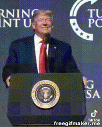 Donald Trump Is Giving A Speech At A Podium In Front Of A Sign That Says Morning Intu GIF