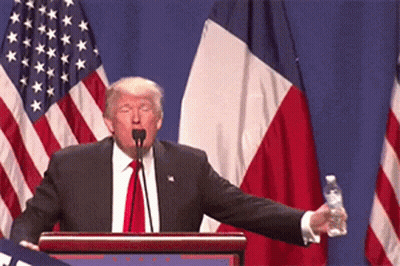 Donald Trump Is Giving A Speech At A Podium While Holding A Water Bottle GIF