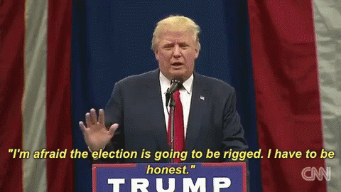 Donald Trump Is Giving A Speech At A Podium With A Sign That Says Trump On It GIF