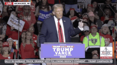 Donald Trump Is Giving A Speech In Front Of A Crowd Of People GIF