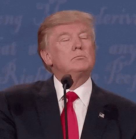 Donald Trump Is Making A Funny Face While Speaking Into A Microphone At A Debate . GIF