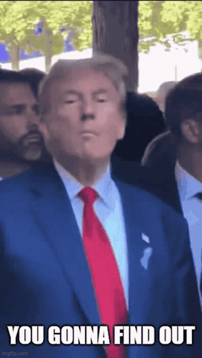 Donald Trump Is Wearing A Blue Suit And Red Tie And Is Standing In A Crowd . GIF