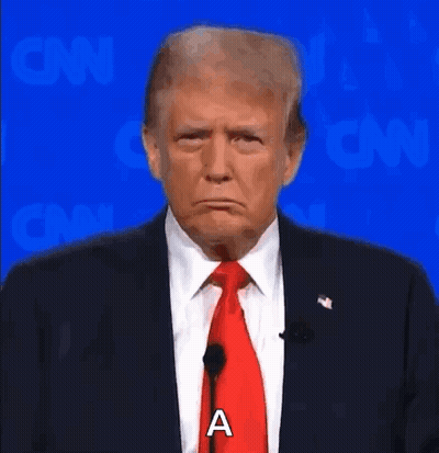 Donald Trump Is Wearing A Suit And Tie And Making A Sad Face While Standing In Front Of A Microphone . GIF