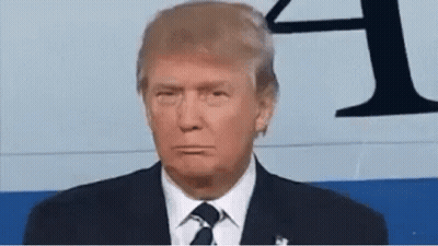 Donald Trump Is Wearing A Suit And Tie While Making A Funny Face . GIF