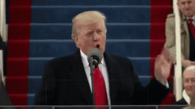 Donald Trump Speaking Into A Microphone While Standing On Stairs GIF