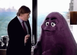Donald Trump Talking To Grimace GIF