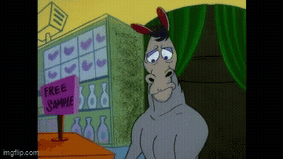 Donkey Standing Before Free Sample Sign GIF