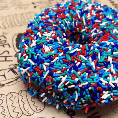 Donut With Blue Red And White Sprinkles GIF