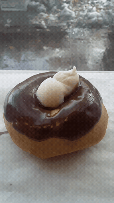 Donut With Chocolate Frosting And Whipped Cream GIF