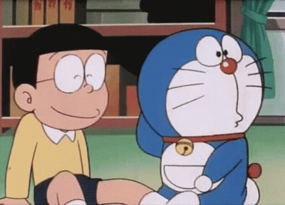 Doraemon And Nobita Sitting Next To Each Other GIF