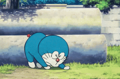 Doraemon Crawling In Grass Near Pipes GIF
