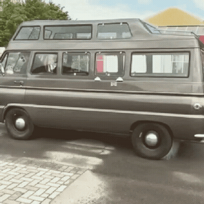 Double Decker Van Parked On Brick Driveway GIF