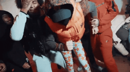 Dougie B Dance Move Wearing Orange Sweater GIF