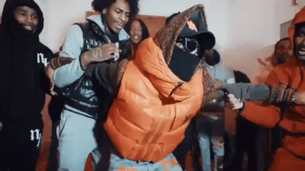 Dougie B In Orange Dancing In The Floor GIF