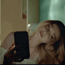 Dove Cameron Holding Phone While Singing GIF
