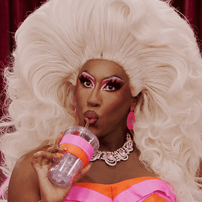 Drag Queen Drinking From Pink Cup GIF