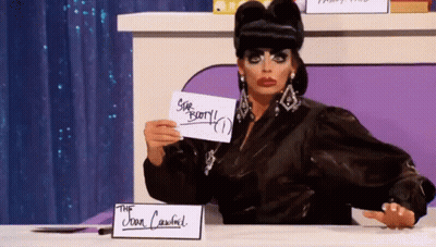 Drag Queen Holding Star Berry Paper GIF