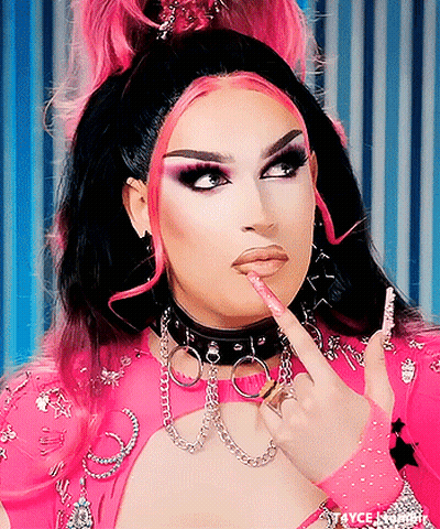 Drag Queen In Choker And Gloves Pointing At Lips GIF