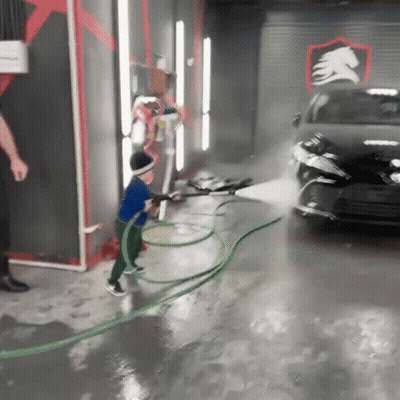 Drag Queen In Crown High-Fiving While Dancing On Stage GIF