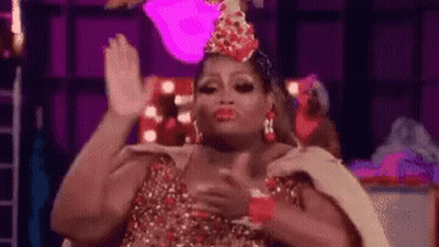 Drag Queen In Crown High-Fiving While Dancing GIF