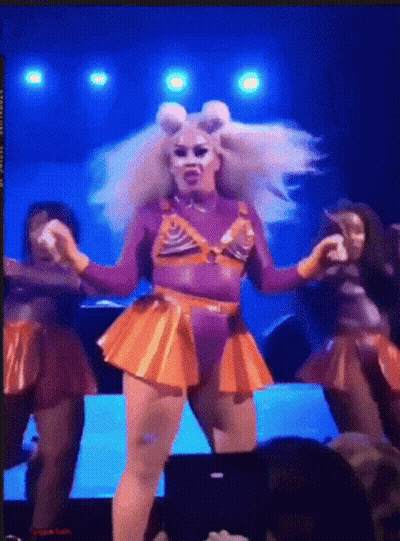 Drag Queen In Purple And Orange Outfit Performing GIF