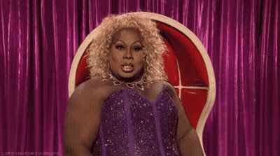 Drag Queen In Purple Dress Pointing GIF