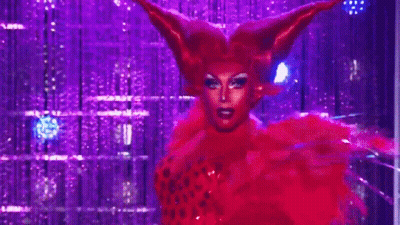 Drag Queen In Red Wig And Feathers GIF