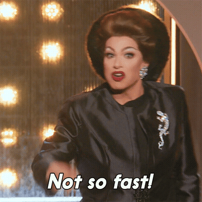 Drag Queen Saying Not So Fast In Black Coat GIF