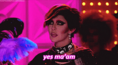 Drag Queen Saying Yes Ma Am With Fan GIF