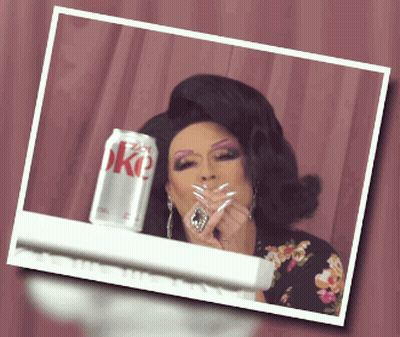 Drag Queen Smoking Cigarette Next To Diet Coke GIF