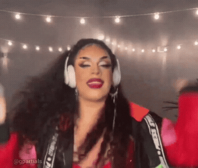 Drag Queen With Headphones And Red Jacket Dancing GIF