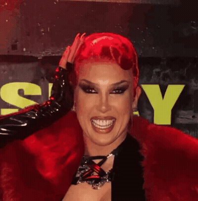 Drag Queen With Red Hair And Black Gloves GIF