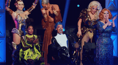 Drag Queens On Stage One With Blue Wig GIF