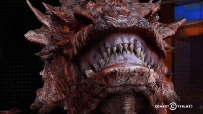 Dragon Head Close Up With Comedy Central Logo GIF