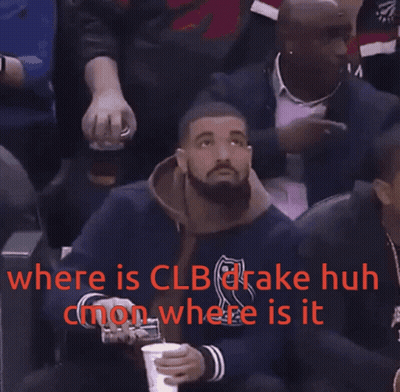Drake Is Sitting In The Stands At A Basketball Game And Holding A Cup GIF