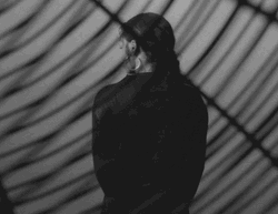 Dramatic Lady In Black Giant Fan GIF
