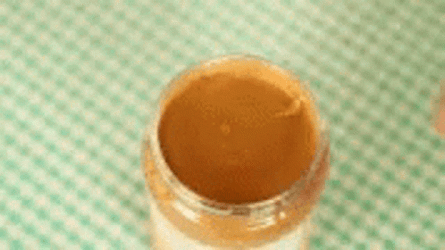 Drawing Sad Face Over Peanut Butter GIF