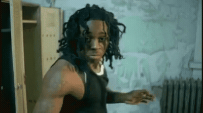 Dreadlocked Man Among Lockers And Radiator GIF