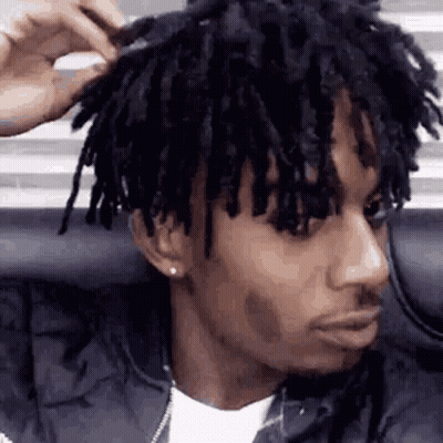 Dreadlocked Man Brushing Hair GIF