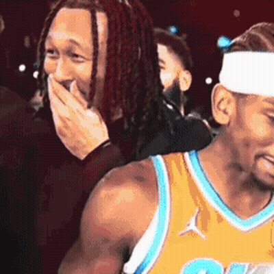 Dreadlocked Man Covering Mouth, Another Laughs GIF