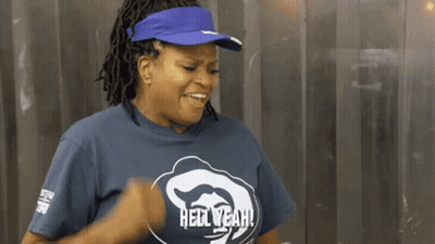 Dreadlocked Man Covers Mouth While Another Laughs GIF