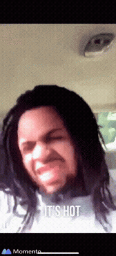 Dreadlocked Man Funny Face Saying It's Hot GIF