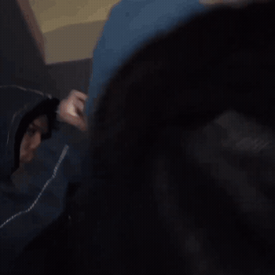 Dreadlocked Man Smoking, Another Drinking From Cup GIF