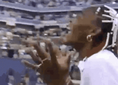 Dreadlocked Man Standing At Stadium Crowd GIF