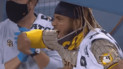 Dreadlocks Man Eating Hot Dog In Mask And Gloves GIF